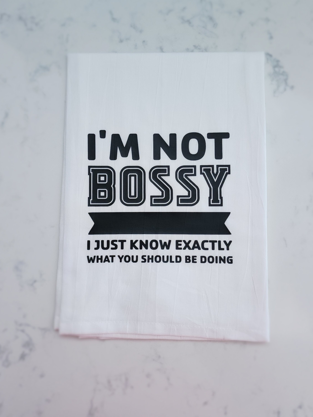 White Tea Towel with Bold Black 'I'm Not Bossy' Quote